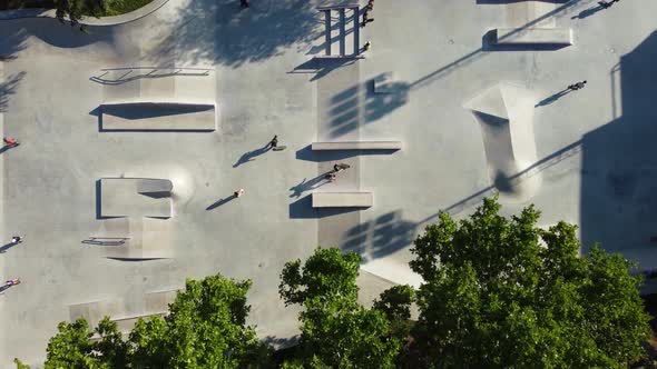 Skateboarders In The Evening At The Park