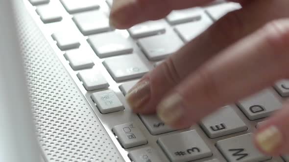 HD - Typing on a Notebook keyboard. Close-up