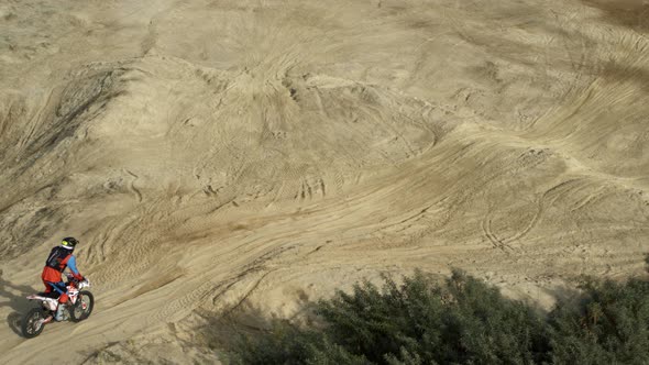 Enduro Motorcycle Rides Offroad on the Sands