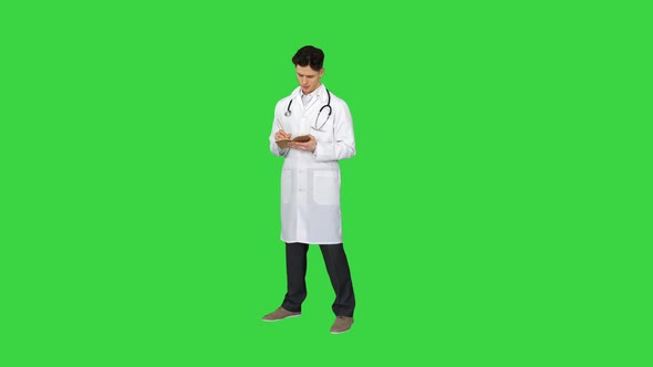 Expressive Young Male Doctor with Creative Idea Starts Dancing on a Green Screen, Chroma Key