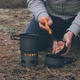 Tourist Is Cooking Pasta With Canned Tuna in a Forest - VideoHive Item for Sale