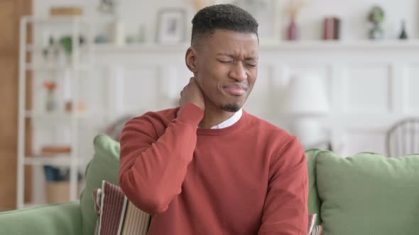 Portrait of African Man having Neck Pain