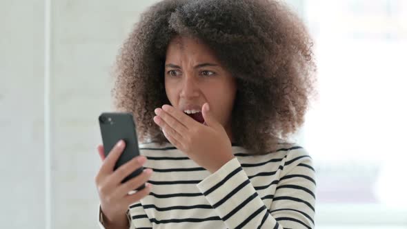 African Woman Having Loss on Smartphone