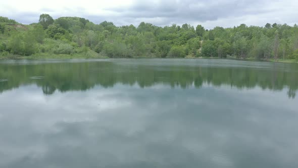 Beautiful color of lake water and coastal area vegetation 4K drone video