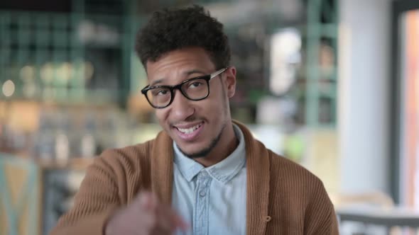 Portrait of African Man Pointing at Camera