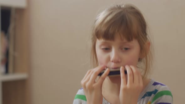 Girl Fooling With Harmonica