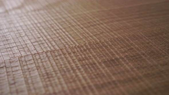 Background from a wooden textured embossed varnished brown surface