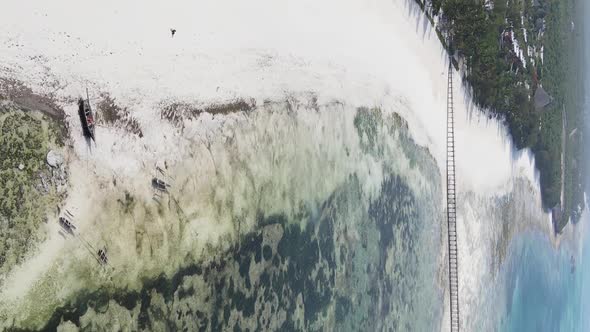 Vertical Video of Low Tide in the Ocean Near the Coast of Zanzibar Tanzania Aerial View