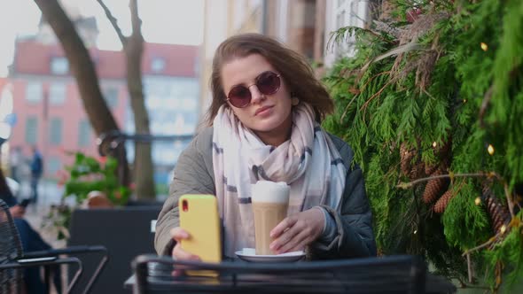 Woman Have a Coffee Break in the Street Cafe of Old Town in Autumn  60p Slow Motion