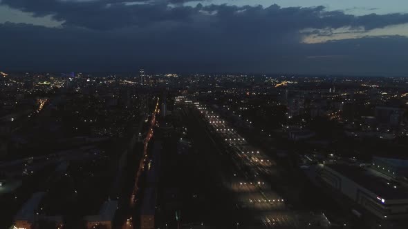 Aerial view of Rail Station with freight trains and cars in a night city 11