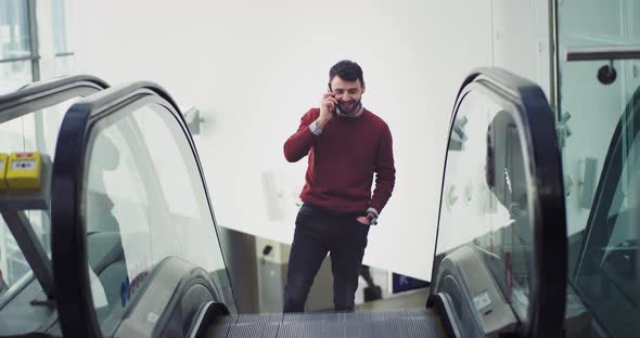 Happy and Smiling Office Worker Get Up on the Escalator