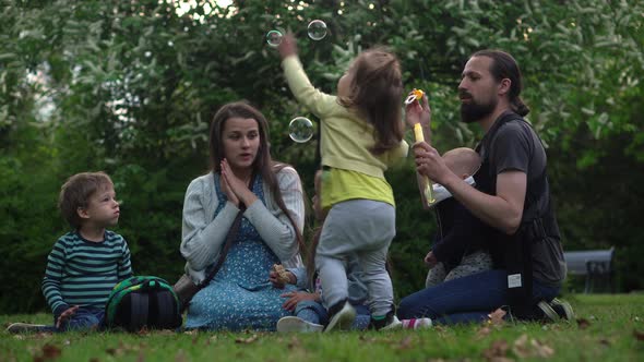 Happy Family Mother Father Three Four Baby Little Siblings Kids Have Fun Blowing Bubbles Enjoying