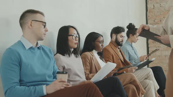 HR Manager Giving Forms to Applicants