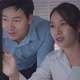 Asian Businessman and Businesswoman looking at desktop computer screen working together - VideoHive Item for Sale
