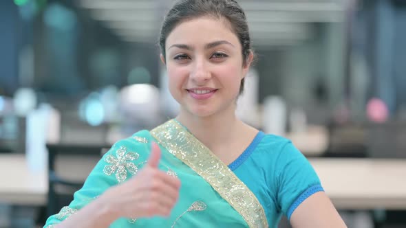 Young Indian Woman showing Thumbs Up Sign