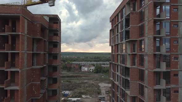 Aerial view of tall residential apartment buildings under construction. Real estate development.