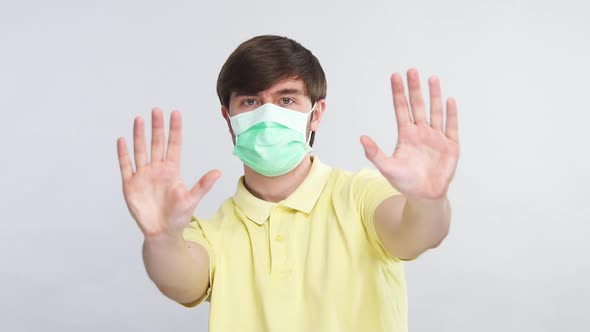 Terrified Man in Sterile Mask Distancing While Coronavirus Disease