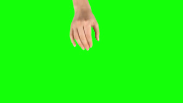 Female Hand Is Performing Spread at Tablet Screen Gesture on Green Screen. Close Up