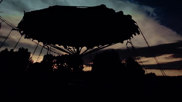 Children Ride on the Carousel in the Evening / Videohive