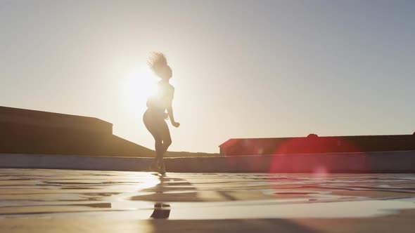 Ballet dancer practicing on rooftop