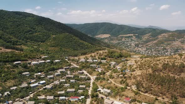 Aerial Drone Tilt Up of Houses on the Hills in Armenia, Noyemberyan