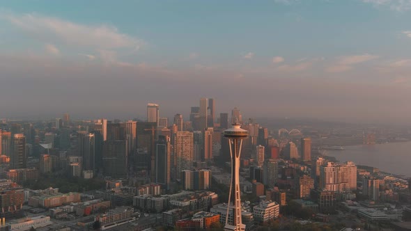 Aerial view of the Space Needle during sunset with Seattle's downtown in the background.