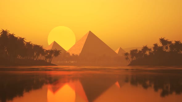 Lake with palms, sand, and silhouettes of the ancient pyramids on the horizon