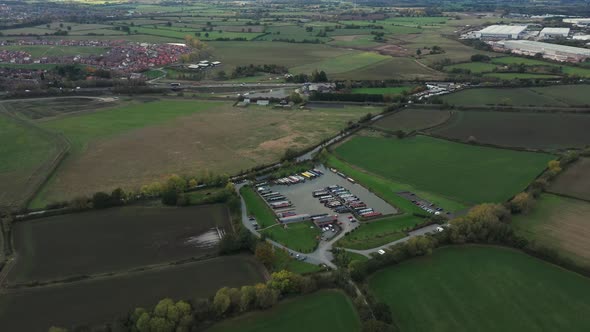 Aerial view of green countryside and cultivated fields at sunset