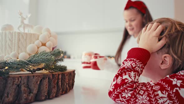 Happy Family with Two Kids Celebrating Christmas at Home