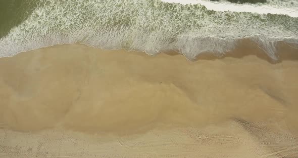 Foamy Waves Splashing On The Sandy Coast Of Gale, Near Camping Praia Da Gale In Portugal - Aerial Dr
