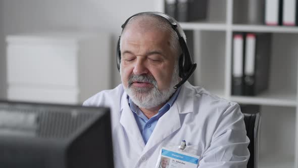 Physician Using Computer in Their Office Doctor Checking Medical Records