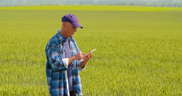 Farmer using digital tablet at farm
