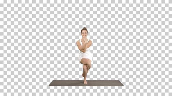 Attractive Girl Standing in The Balancing Yoga Pose Garudasana