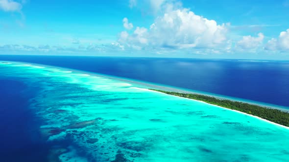 Aerial drone shot panorama of paradise coastline beach vacation by clear ocean with white sandy back