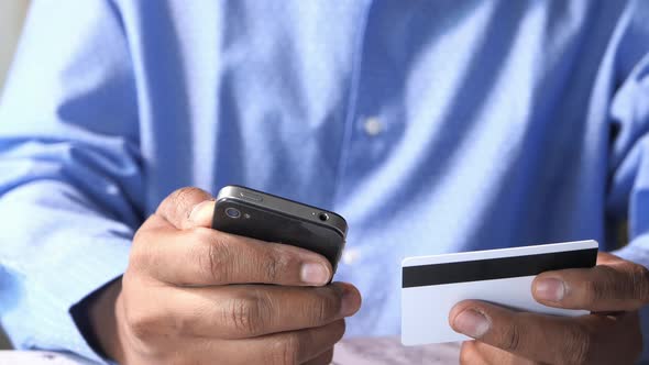 Businessman Holding Credit Card and Using Smart Phone Shopping Online 