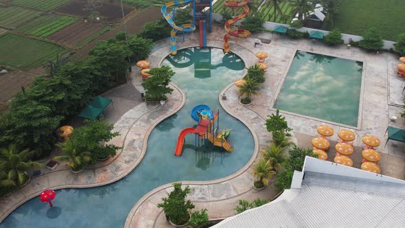 Aerial view of outdoor swimming pool in hotel resort for vacation travel at Bekasi