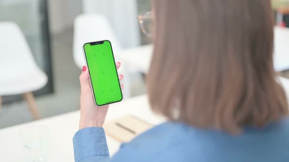 Young Woman using Smartphone with Chroma Screen