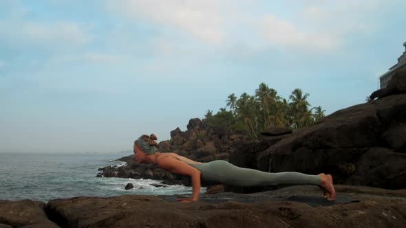 Woman Changes Pose To Urdhva Nukha Shvanasana Slow Motion