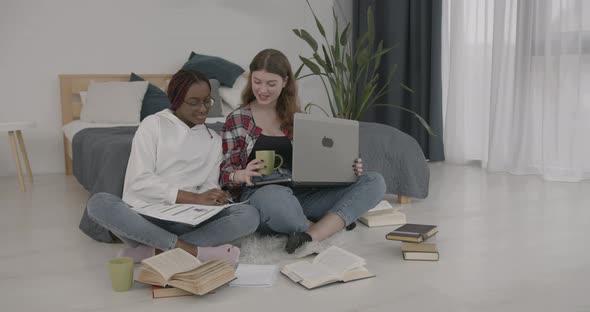 Multi Ethnic Girls Studying Together at Home