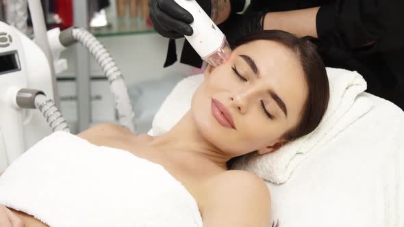 Beautiful Woman Lying at Spa and Having Facial Procedures