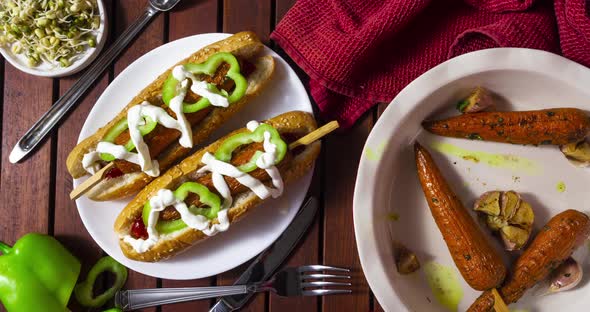 Hot dog with carrots. Stop motion animation with vegetarian fast food