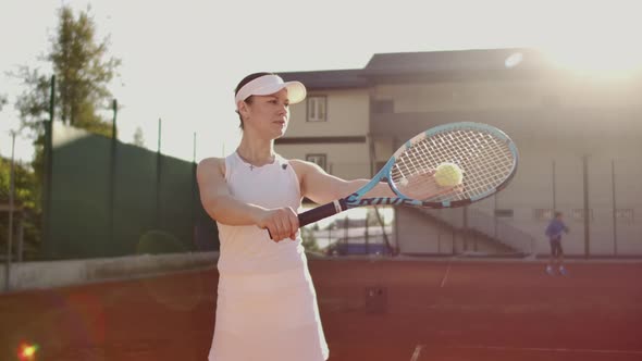 Tennis Player Prepares To Serve Ball During Tennis Match