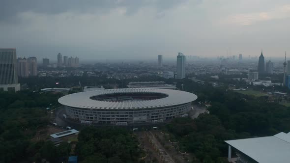 Aerial Dolly Shot of Gelora Bung Karno Athletic Stadium Facilities in Urban City Center of Jakarta