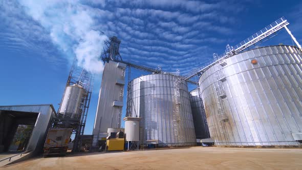 Large Grain Bins. Modern Granary elevator. Agribusiness.