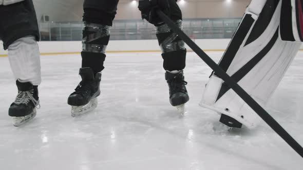 Hockey Players Legs On Ice Rink