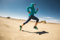 Fitness woman trail runner cross country running on sand desert - PhotoDune Item for Sale