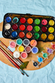 Flat lay of colorful paints, painting palette and brushes - PhotoDune Item for Sale