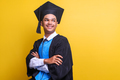 Confident young graduated man smiling with crossed arms  - PhotoDune Item for Sale