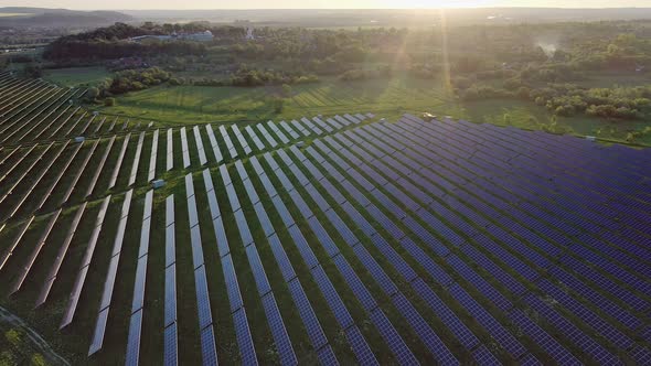 Ecology solar power station panels in the fields green energy at sunset