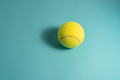 Tennis ball with light blue background - PhotoDune Item for Sale
